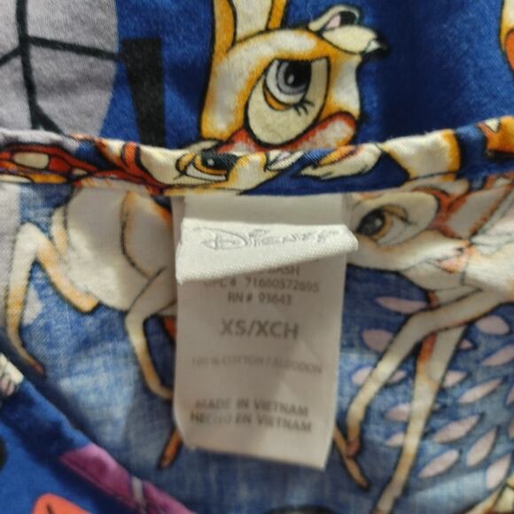 Disney Bambi Nurse Scrub Top Short Sleeve V-Neck Pockets Blue Womens Size XS - Picture 4 of 6